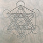 Close-up of the sacred Metatron’s Cube engraving on the Sadhu board.