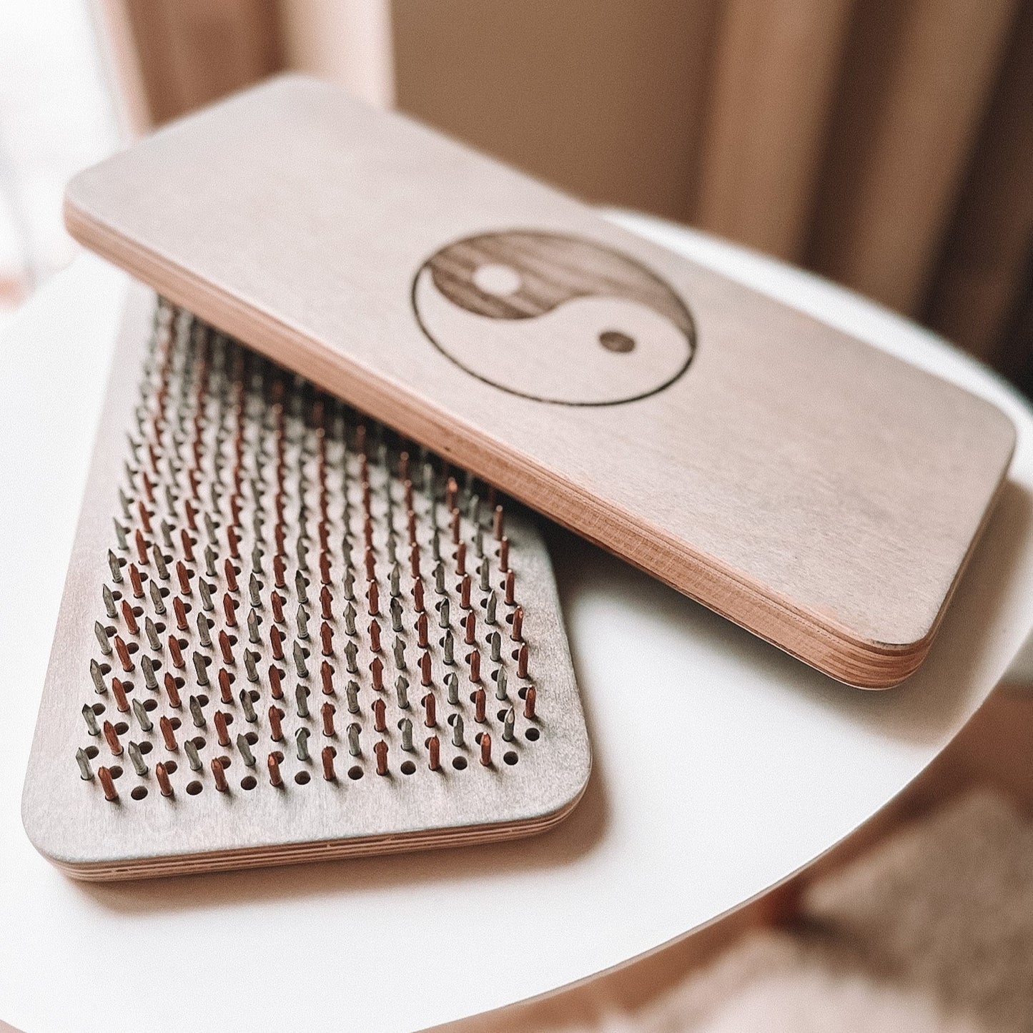 Top view of the Yin-Yang Sadhu Board with copper and stainless nails, designed for reflexology and energy balancing.